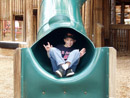 Click for detailed view of image P2180597_-_Jake_exiting_slide_-_2002-02_-_Sugar_Sand_Park