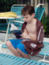 Click for detailed view of image P2220658_-_Jake_reading_at_satellite_pool