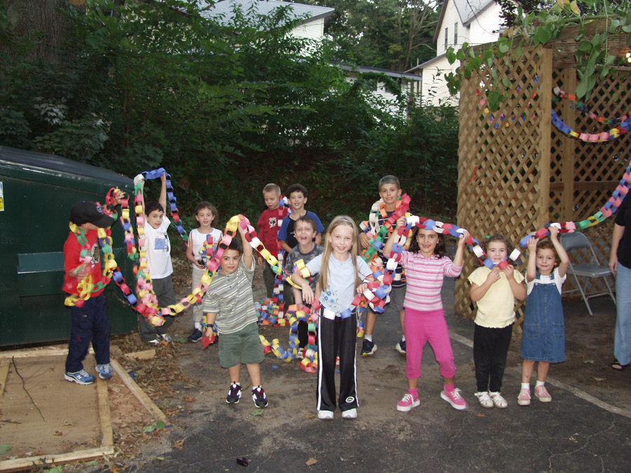 Click to return to grid view of the "Temple Shalom Emeth - 2002-03" gallery "Sukkah Decorating (all images)"
