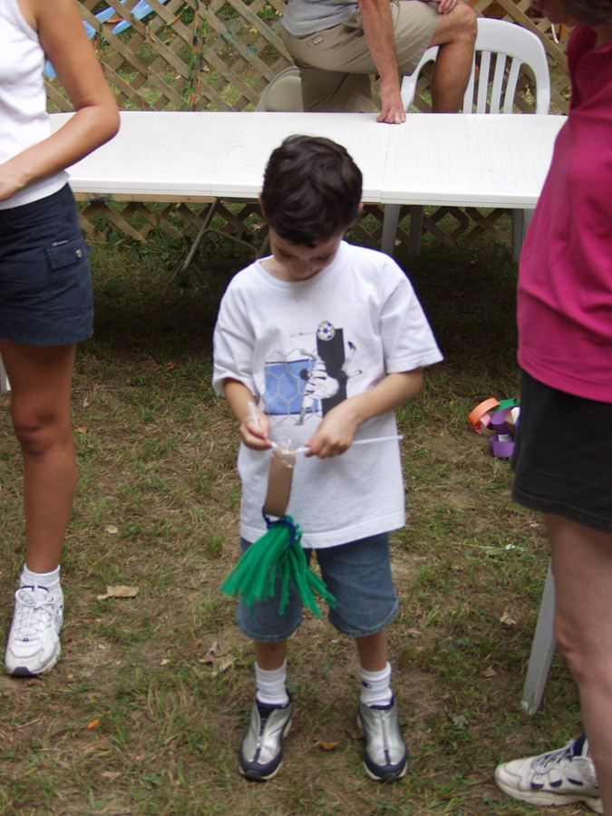 Click to return to grid view of the "Temple Shalom Emeth - 2002-03" gallery "Sukkah Decorating at Rabbi’s House"
